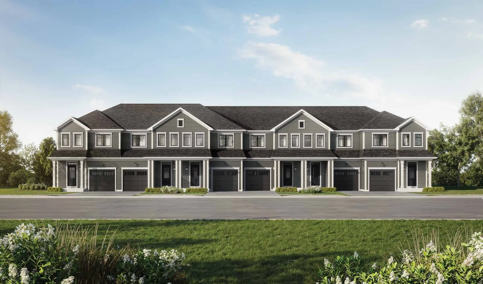 Rendering of a block of traditional 20-foot townhomes at Wellwood with front garages and covered porches